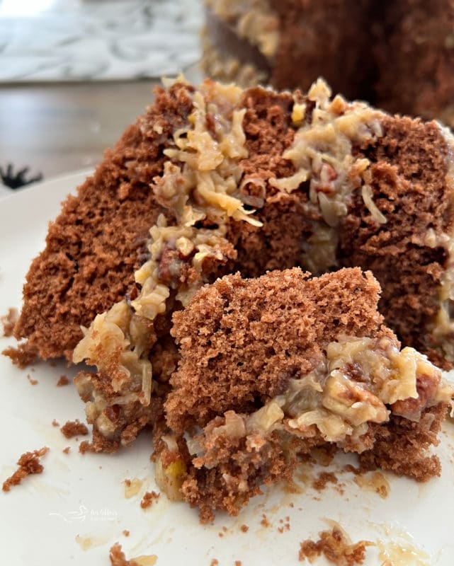 front view of German chocolate cake with coconut pecan frosting layers