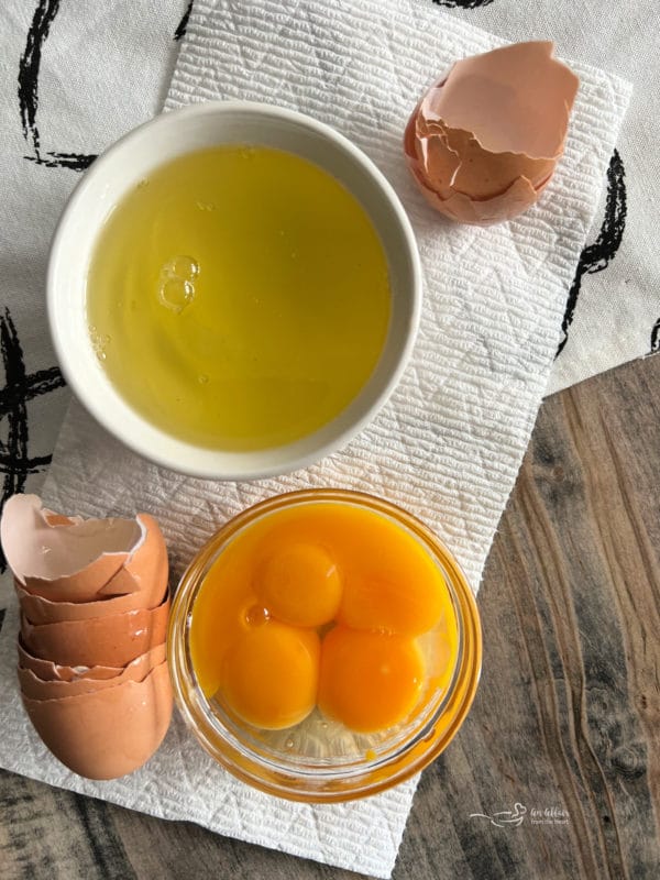 egg whites and egg yolks in separate bowls 