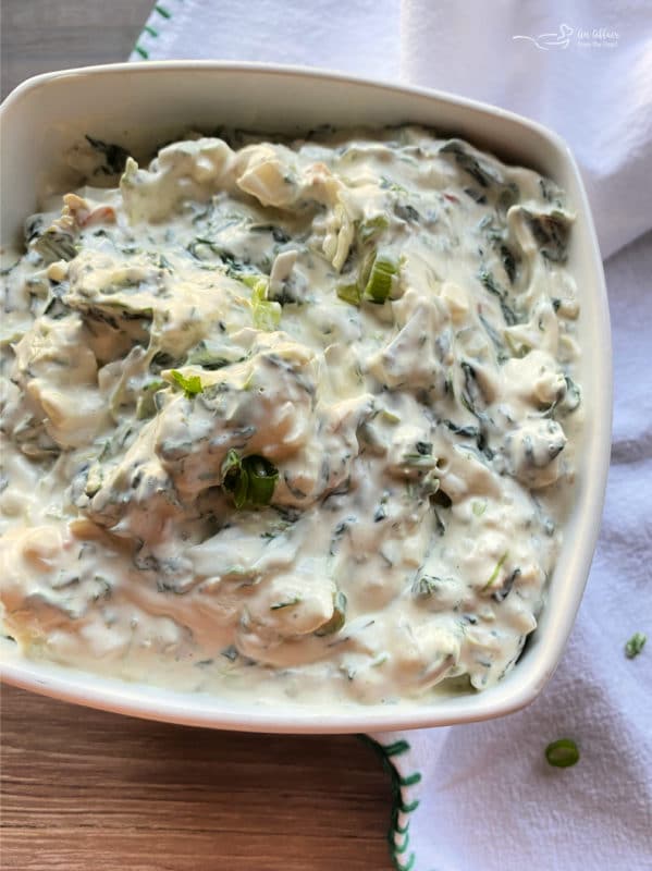 white bowl with spinach dip