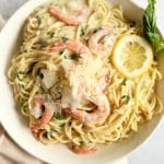 Shrimp Pasta in a Bowl with Lemon Slices and Basil