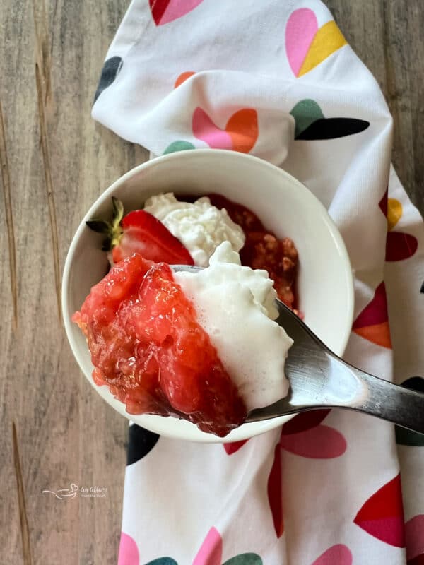 Strawberry Rhubarb Dessert with Whipped Cream on Fork