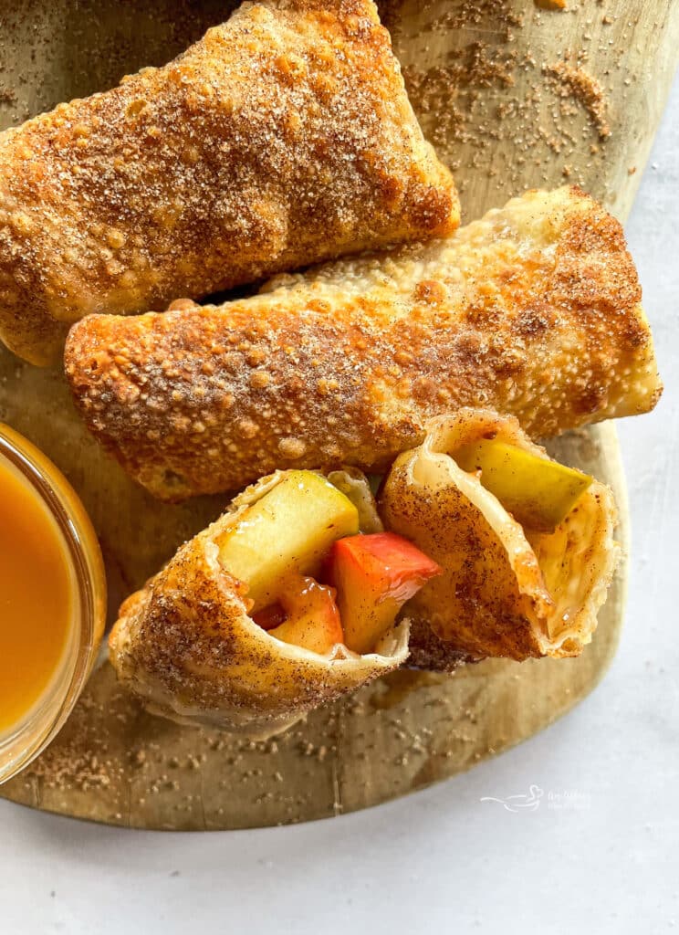 Close up of the inside of an air fryer apple pie egg roll.