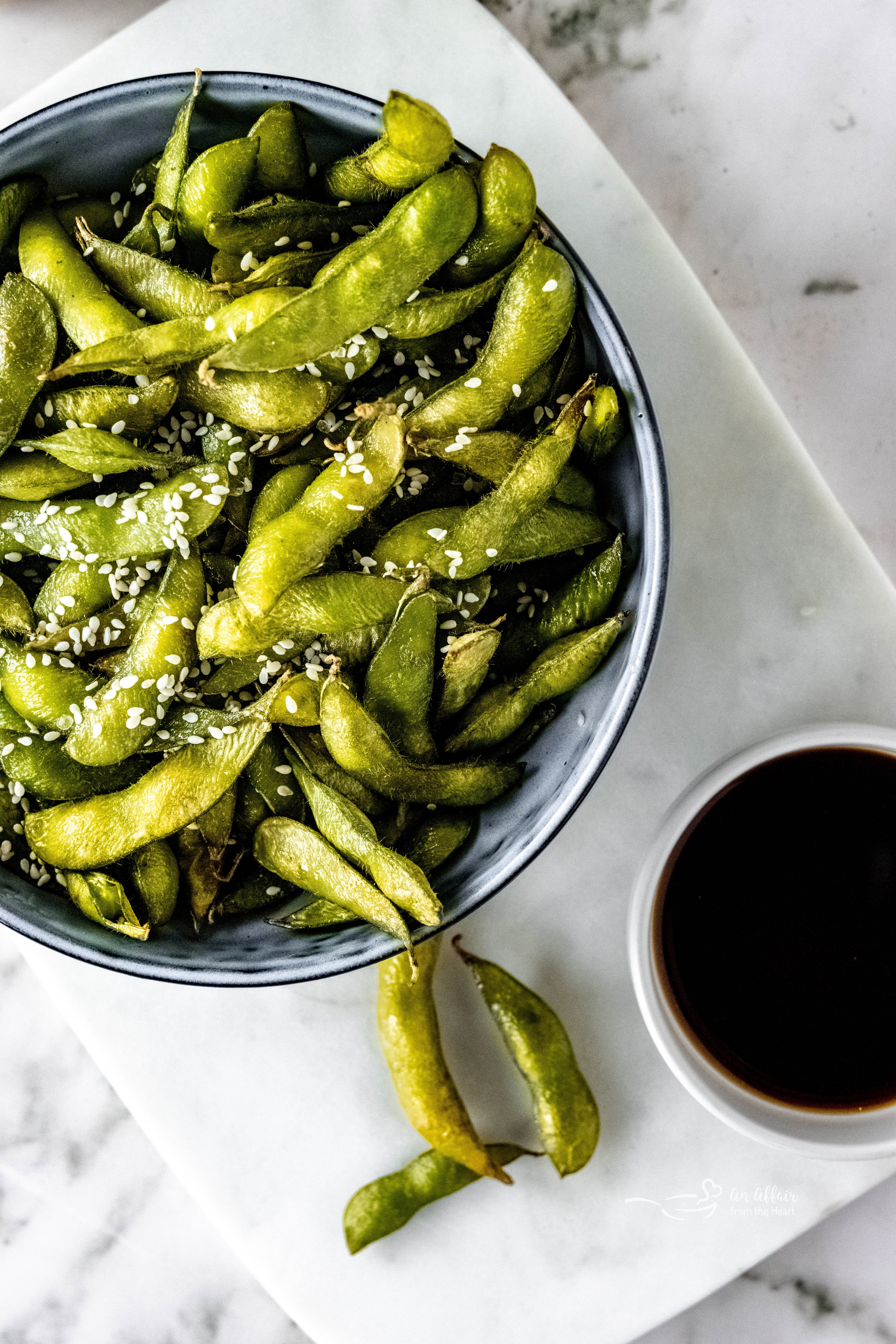 Air Fryer Edamame Beans in a white serving bowl.