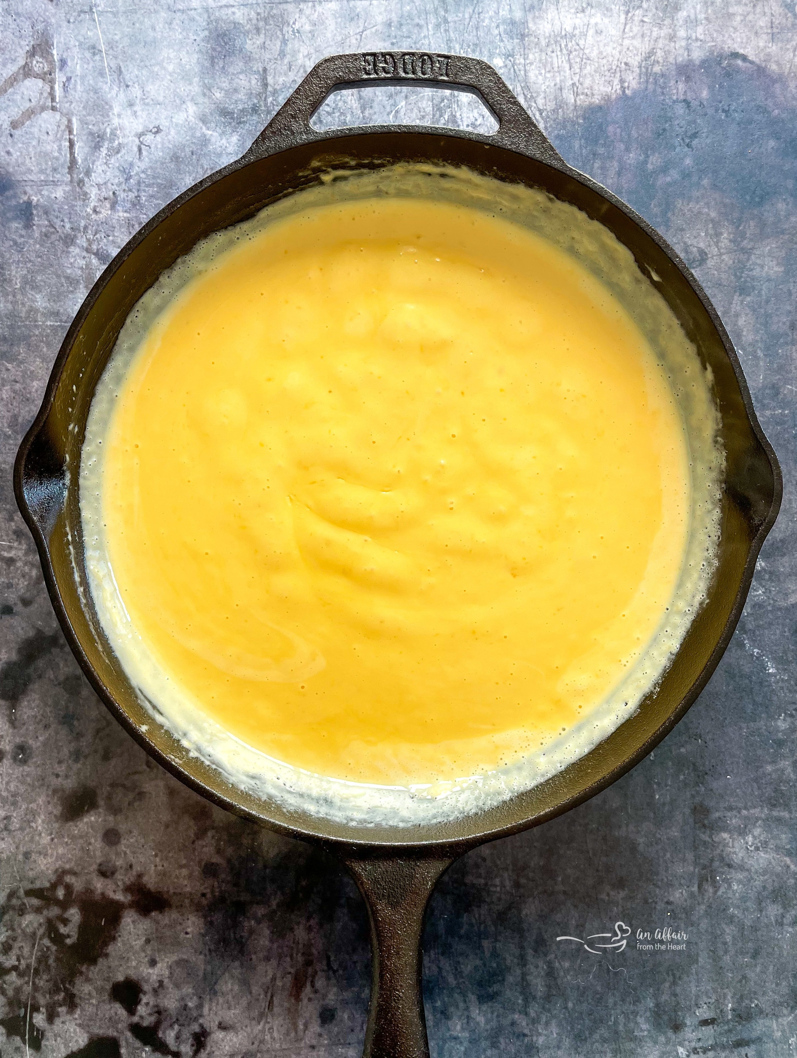 Restaurant-Style CPK Mac and Cheese Recipe 7 Melting Velveeta and cream for the sauce