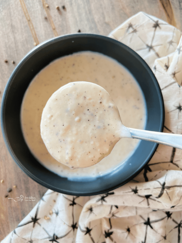 simple white country gravy close up in a serving ladle
