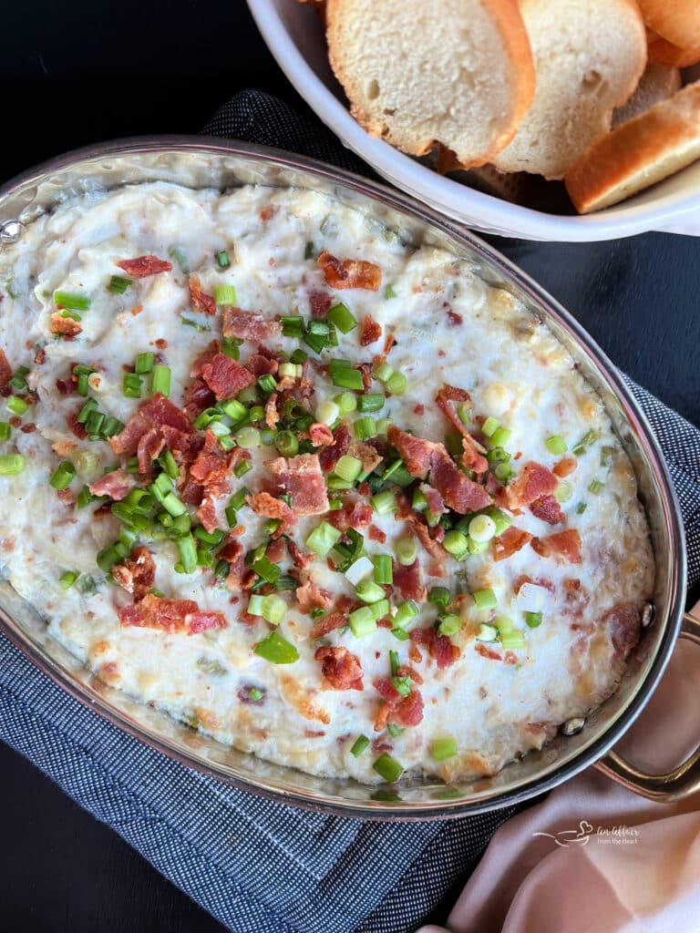 Sauerkraut, Bacon & Swiss Dip in a metal baking dish.