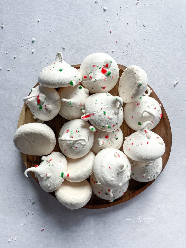 Peppermint Meringues in a wooden serving dish.