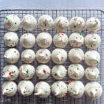 Close up of peppermint Meringues lined up on a cooling rack.