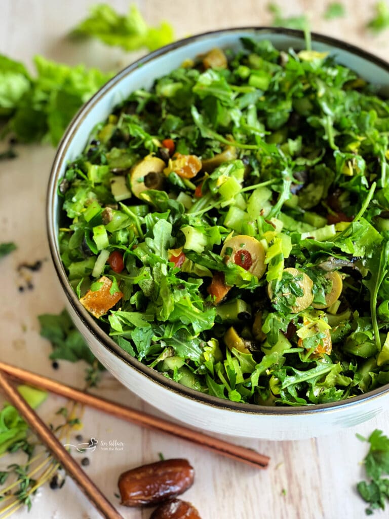 Mediterranean Celery salad in a large, white serving bowl.