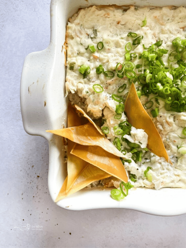 Crab Rangoon dip with wonton chips in it.