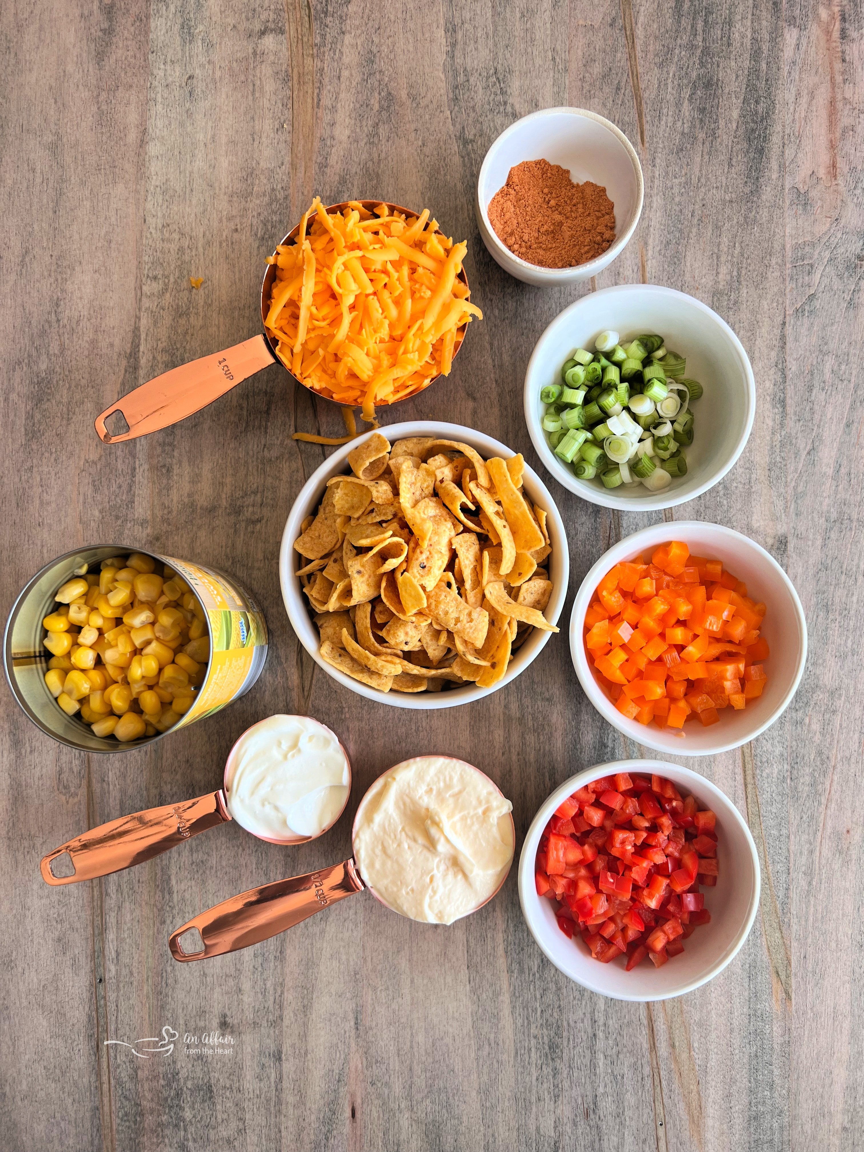 Fiesta Frito Corn Salad 3 Close-up of Frito Corn Salad in a serving bowl, showcasing the creamy texture, corn, peppers, and Frito chips