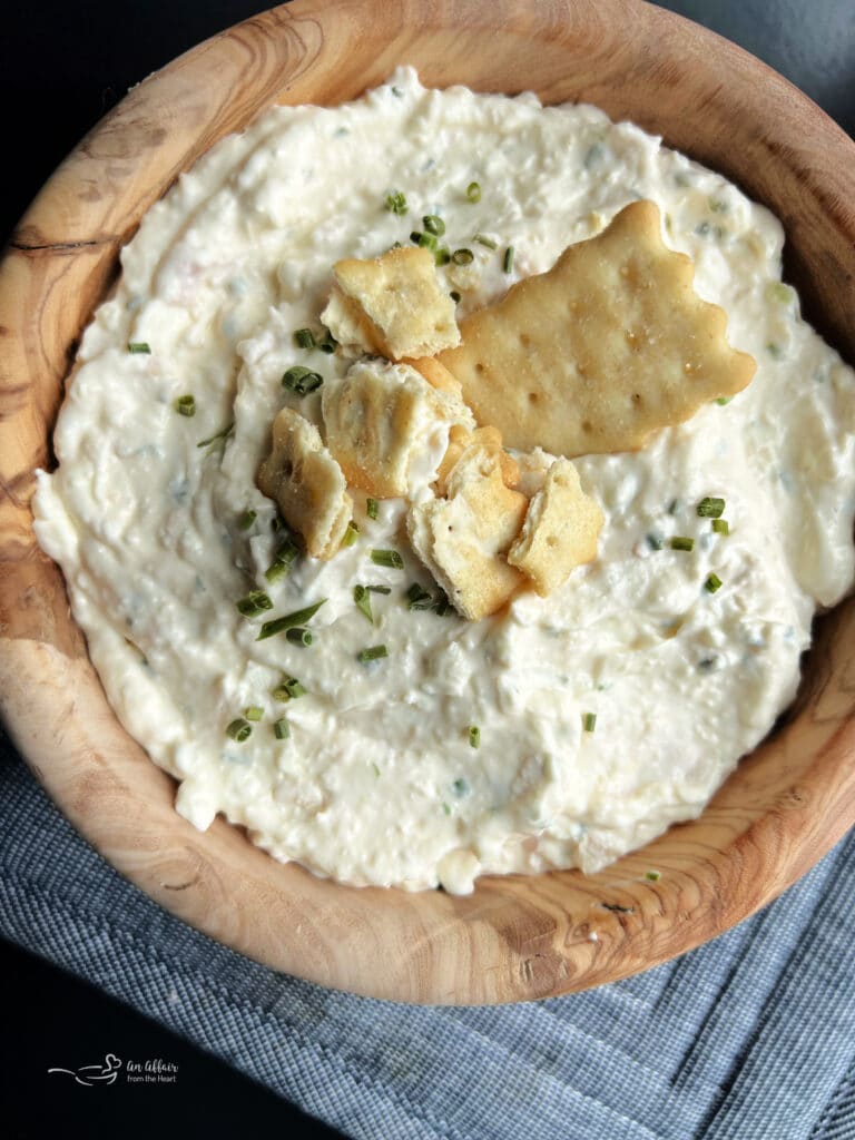 Close up of Chicken in a Biskit Dip in a wood bowl.