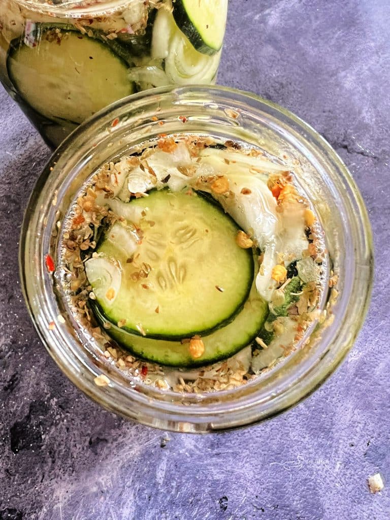 Sweet & Spicy Refrigerator Pickles in a mason jar