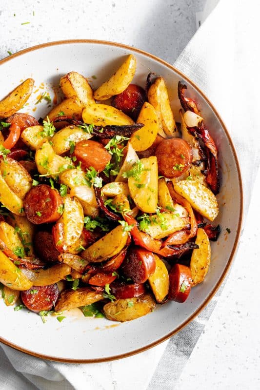 Air Fryer Sausage & Potatoes in a white serving bowl