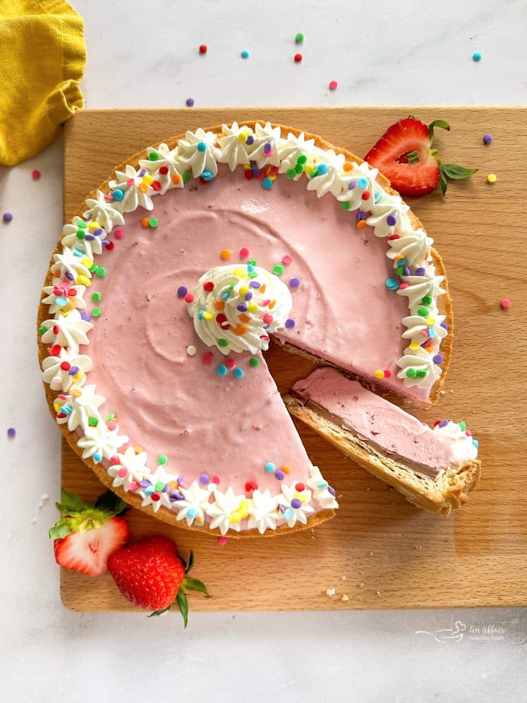 Cutting a slice from the Ice Cream Cookie Cake on a wood board