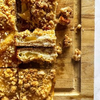 Close up of Apple Pie Crumb Bars on their side so we can see the inside