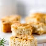 Side view of a piece of garlic rosemary focaccia bread