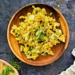 Mom's Macaroni salad on a wooden plate.