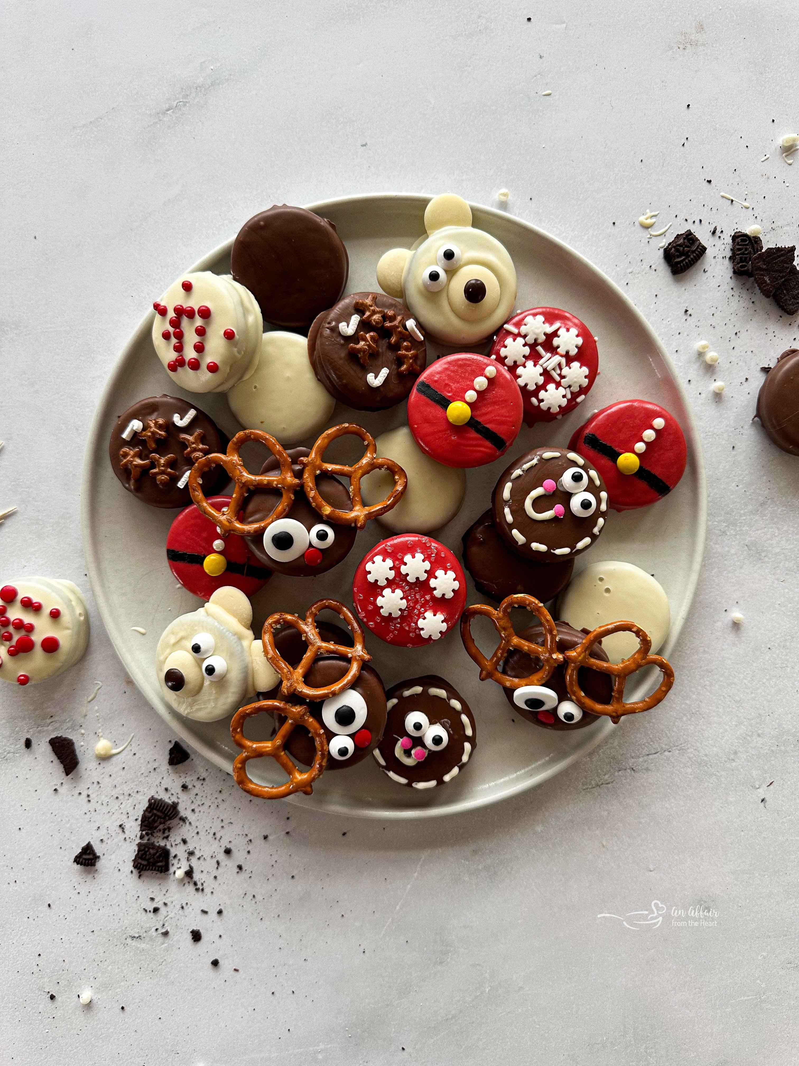 Overhead of Christmas Oreos on a white plate.