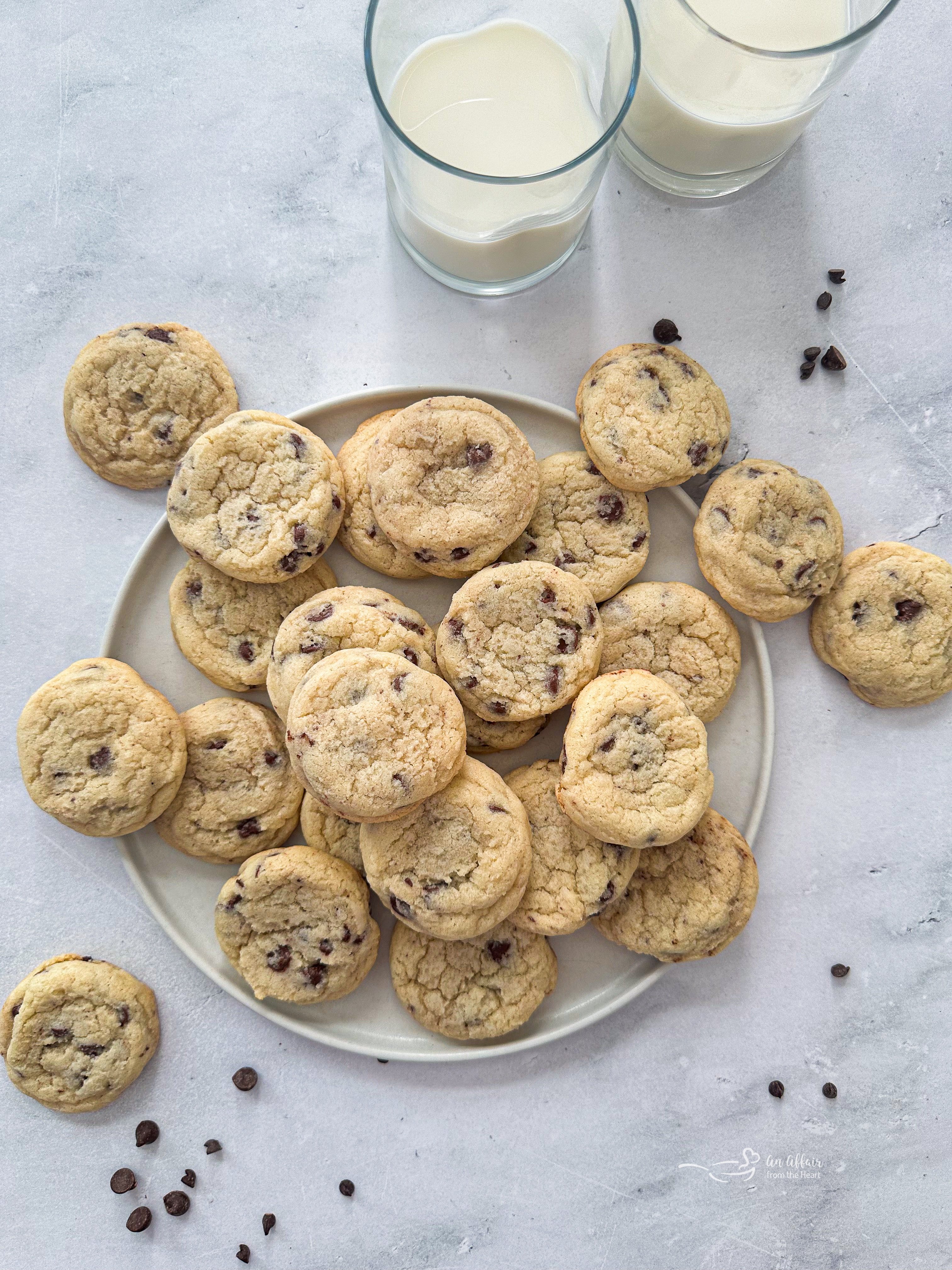 Overhead of Chocolate Chip Sugar Cookies and 2 glasses of milk