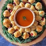 Dorothy's Pigs in a Blanket Wreath on a wood stump serving platter