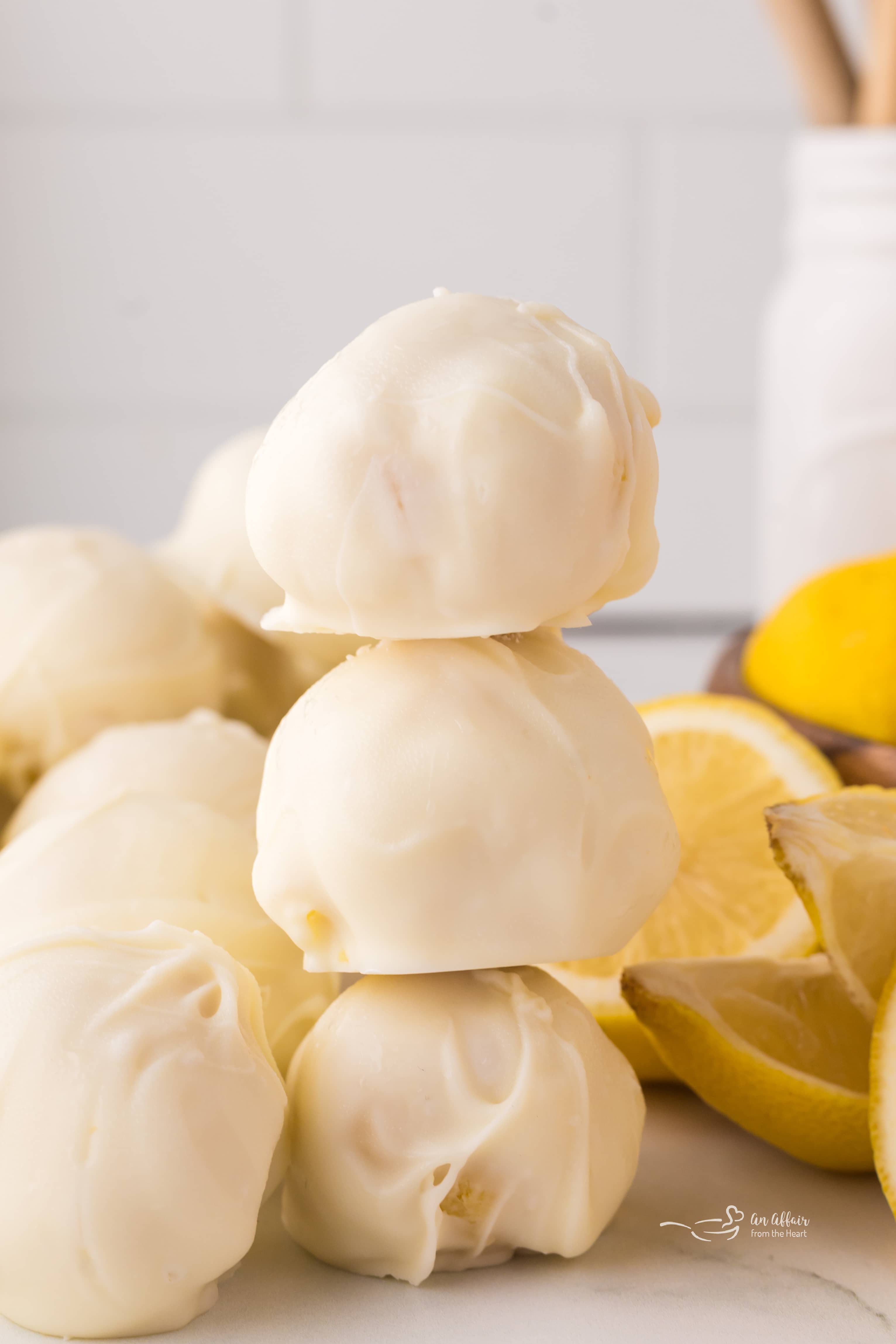 Extreme close up of White Chocolate Lemon truffles stacked