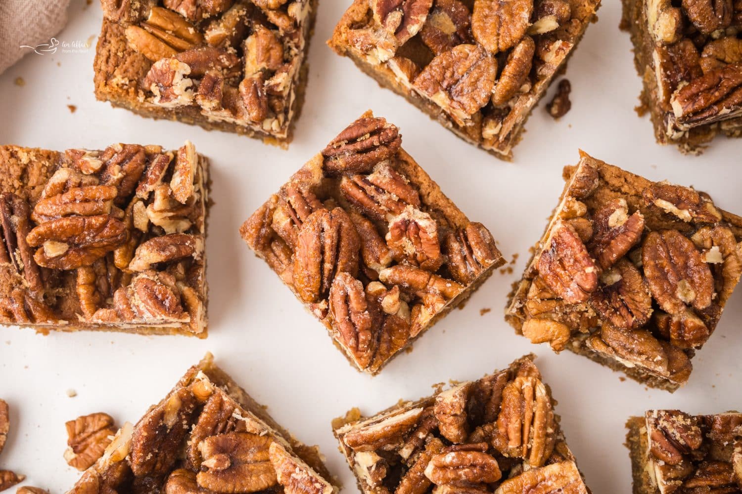 Pecan Pie Blondies spread out on a counter top.